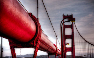 Red pipe bridge mountains cloudy - saturated free wallpaper