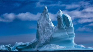 Iceberg ocean cloudy sky ecological - a large iceberg free wallpaper