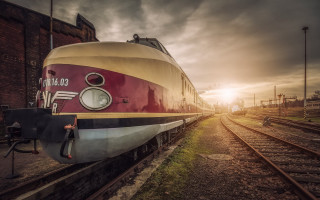 Train building sunset cloudy artdeco - a train free wallpaper