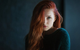 Red haired woman serious portrait 3 - her face and shoulders free wallpaper