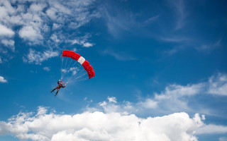 Paragliding cloudy day red parachute - a cloudy day free wallpaper for desktop