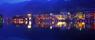 Sumatraism city lake mountain night - the building and the water free wallpaper