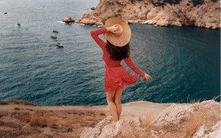 Woman red dress hat cliff 2 - a red dress and hat free wallpaper for desktop