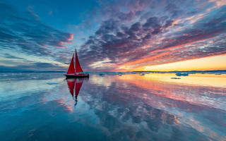 Sailboat sunset water ice floes - a sailboat free wallpaper