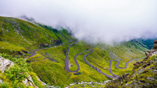 Winding road mountains cloudy sky - road free wallpaper for desktop