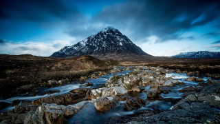 Mountain stream rocks cloudy sky - adam bruce thomson free wallpaper