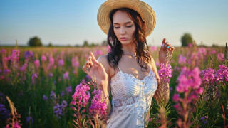 Woman hat flower field portrait - her finger free wallpaper