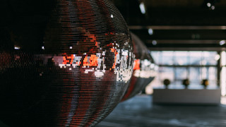 Large mirror ball building people - window free wallpaper