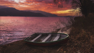 Lake shore mountain sunset forest - a mountain range in the background free wallpaper