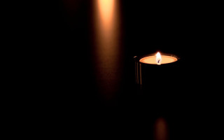 Candle lit dark black background - a candle free wallpaper