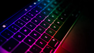 Keyboard multicolored light black background - synthwave style free wallpaper