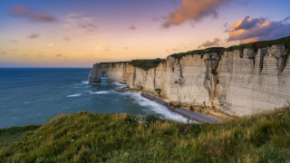 Cliff ocean sunset cloudy sky - de hirsh margule free wallpaper