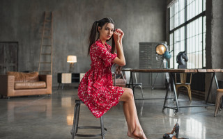 Woman red dress sitting indoor - a chair in a room free wallpaper