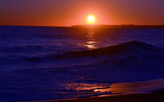 Sunset ocean boat beach sky - the beach in the foreground free wallpaper