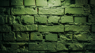 Green brick wall clock light - side and a light free wallpaper