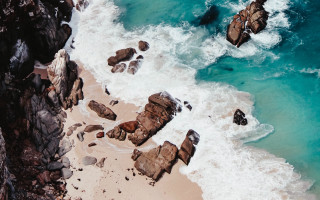 Beach rock formation water shore - a rocky shore free wallpaper