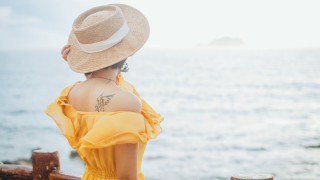 Woman yellow dress hat ocean 3 - tattoo free wallpaper