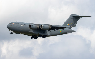 Military plane cloudy sky landing - a large military plane free wallpaper