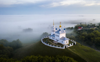 White church blue domes fog - top of a hill free wallpaper