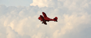 Red plane blue sky clouds - dieselpunk free wallpaper