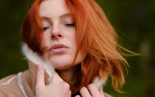 Red haired woman feather portrait - a feather free wallpaper