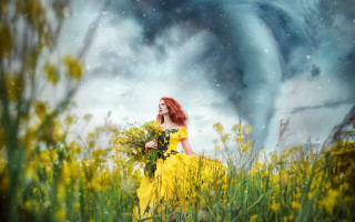 Woman yellow dress flower field 3 - a yellow dress holding free wallpaper