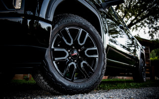 Black truck tire trees building - sharp detail free wallpaper