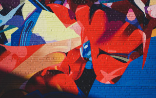 Large colorful graffiti brick wall - side and a clock free wallpaper