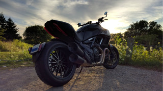 Motorcycle field flowers trees cloudy - dusk free wallpaper