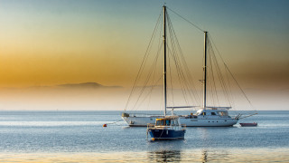 Sailboat mountain fog sunset tranquil - a sailboat free wallpaper