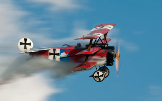 Red white airplane clouds pilot - a propeller free wallpaper