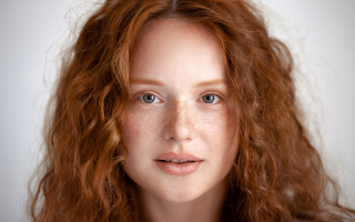 Freckled woman smile realistic portrait - shaded free wallpaper