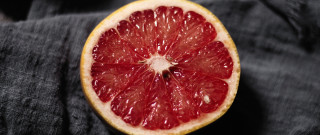 Grapefruit halved blackcloth whitecenter food - half free wallpaper