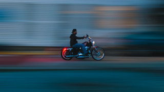 Man motorcycle street building clock - motion blur free wallpaper