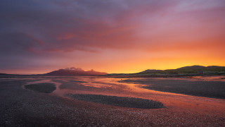 Sunset beach mountain city lights - a sunset over a beach free wallpaper