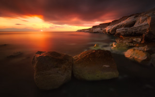 Sunset rocky beach mystical colors 4 - the foreground and a body of water free wallpaper