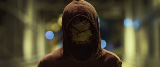Hooded clock face dark room - their face free wallpaper
