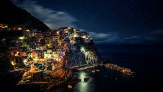 Cliff village night ocean bridge - evgeny lushpin free wallpaper