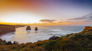 Sunset ocean cliffs beach landscape - a few person free wallpaper