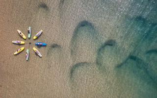 Surfboards beach ocean footprints land - a sandy beach next free wallpaper