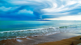 Large cloud ocean beach area - surrealism free wallpaper