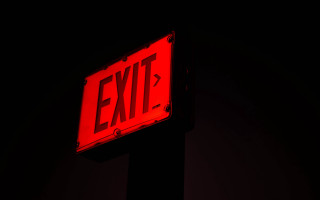 Red exit sign dark night - diffuse free wallpaper