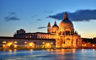 Dome clock tower night cityscape - the water and a boat in the foreground free wallpaper
