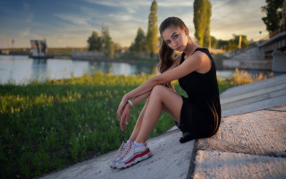 Woman sitting lake sunset portrait - her shoe free wallpaper