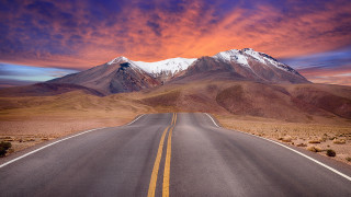 Mountain road orange sky ocean - a long road free wallpaper