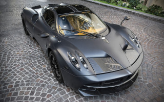 Black sports car cobblestone city - art deco free wallpaper for desktop