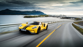 Yellow sports car ocean bridge - a yellow sports car free wallpaper for desktop