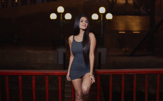 Woman balcony red railing night - a balcony next free wallpaper