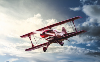 Red biplane shark mouth clouds - the wing free wallpaper