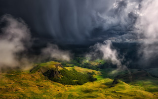 Mountain range stormy sky green - a storm free wallpaper